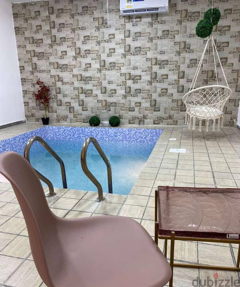 Small covered jacuzzi-style pool