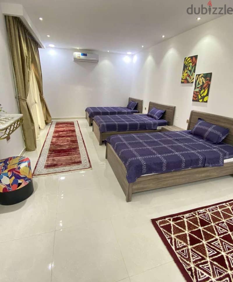 Shared bedroom with six single beds